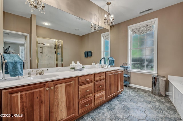 bathroom with vanity, a notable chandelier, and walk in shower