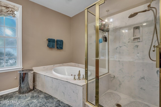 bathroom featuring separate shower and tub