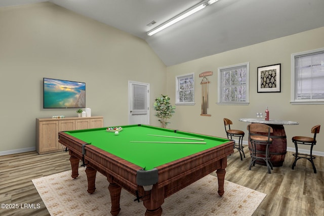 rec room with lofted ceiling, billiards, and light wood-type flooring