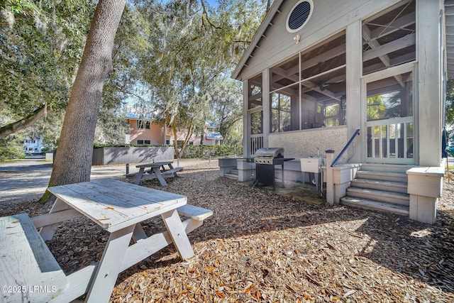 view of yard with a sunroom