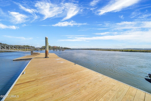 view of dock with a water view