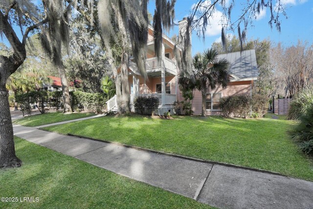 view of property's community with a lawn