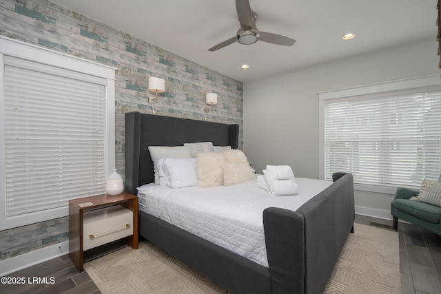 123 Sandcastle Ct, Hilton Head Island, SC 29928 - bedroom featuring an accent wall, wallpapered walls, baseboards, wood finished floors, and recessed lighting