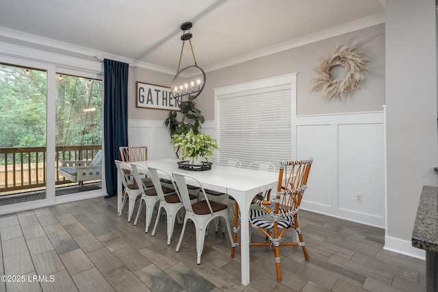123 Sandcastle Ct, Hilton Head Island, SC 29928 - dining space featuring a decorative wall, ornamental molding, wainscoting, a chandelier, and wood finished floors
