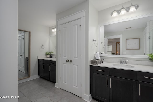 123 Sandcastle Ct, Hilton Head Island, SC 29928 - bathroom with vanity, tile patterned floors, baseboards, and a closet