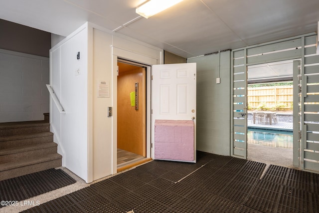 123 Sandcastle Ct, Hilton Head Island, SC 29928 - unfurnished room featuring concrete block wall and stairs