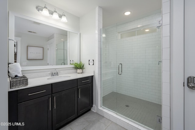 123 Sandcastle Ct, Hilton Head Island, SC 29928 - bathroom featuring tile patterned floors, vanity, a stall shower, and recessed lighting
