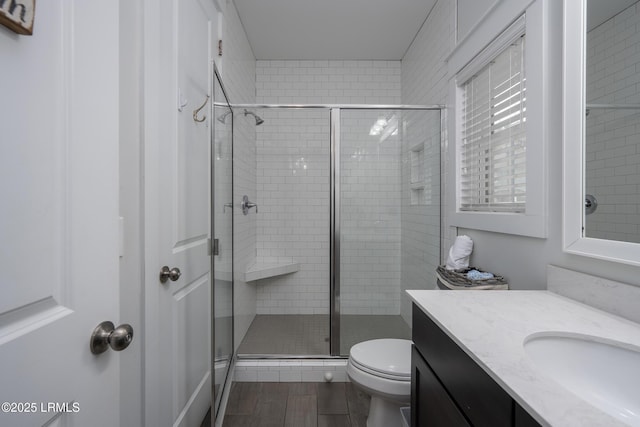 123 Sandcastle Ct, Hilton Head Island, SC 29928 - bathroom with vanity, a shower stall, toilet, and wood finished floors