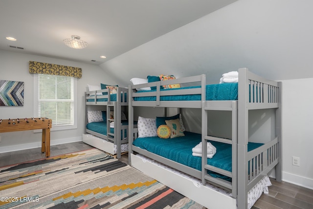 123 Sandcastle Ct, Hilton Head Island, SC 29928 - bedroom featuring wood finished floors, baseboards, vaulted ceiling, and recessed lighting