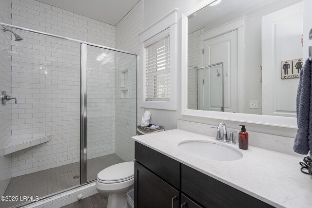 123 Sandcastle Ct, Hilton Head Island, SC 29928 - bathroom with vanity, toilet, and a stall shower