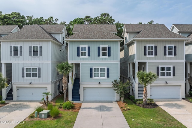 123 Sandcastle Ct, Hilton Head Island, SC 29928 - coastal home featuring stairway, board and batten siding, and an attached garage