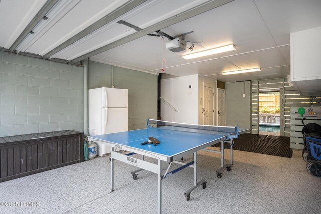 123 Sandcastle Ct, Hilton Head Island, SC 29928 - playroom with a garage, concrete block wall, and speckled floor