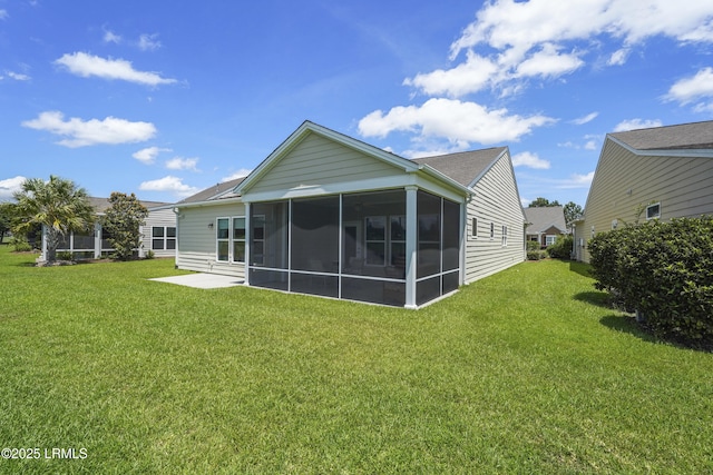 509 Nautical Ln, Okatie, SC 29909 - rear view of house featuring a sunroom and a yard