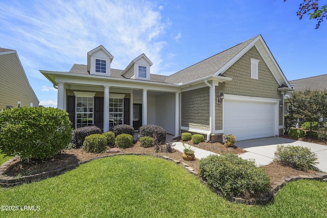 509 Nautical Ln, Okatie, SC 29909 - view of front of property featuring driveway, roof with shingles, a front lawn, a garage, and a porch