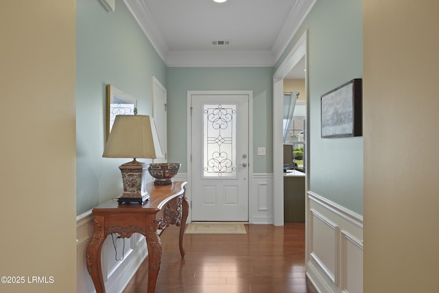509 Nautical Ln, Okatie, SC 29909 - entryway with crown molding, a decorative wall, wood finished floors, and a wainscoted wall