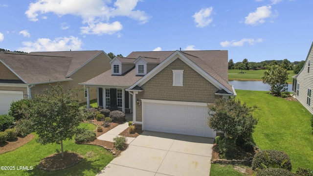 509 Nautical Ln, Okatie, SC 29909 - view of front facade featuring driveway, a water view, a front yard, a garage, and a shingled roof