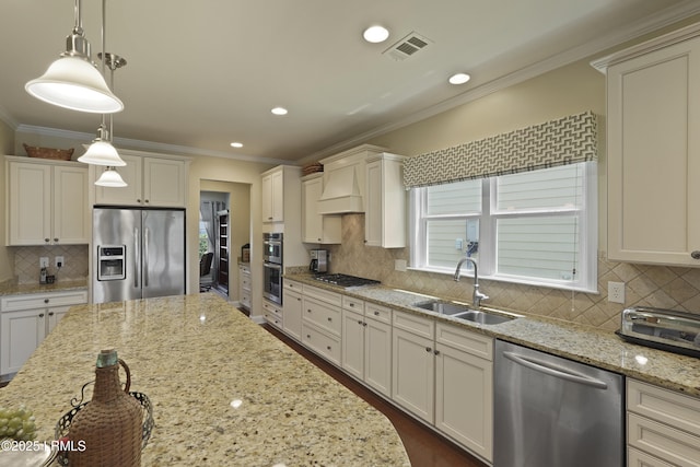 509 Nautical Ln, Okatie, SC 29909 - kitchen with appliances with stainless steel finishes, a sink, crown molding, decorative backsplash, and hanging light fixtures