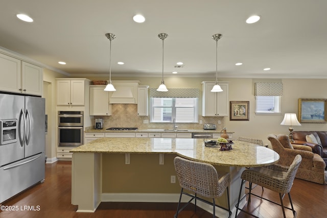 509 Nautical Ln, Okatie, SC 29909 - kitchen with stainless steel appliances, a sink, premium range hood, open floor plan, and crown molding