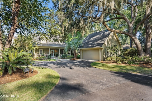 view of front of house with a garage and covered porch