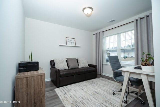 office area featuring dark wood-type flooring