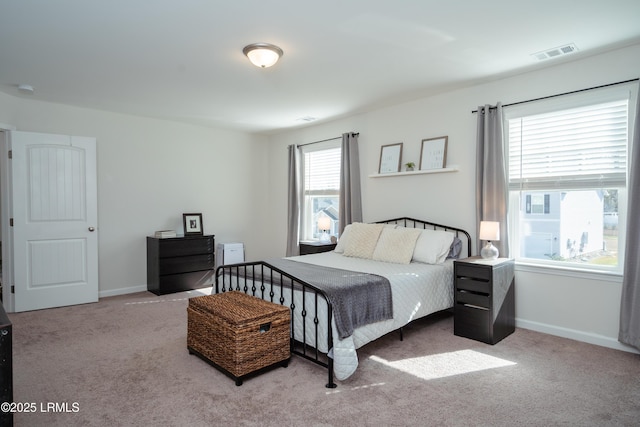 bedroom with light carpet