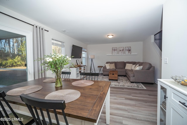 dining space featuring dark wood-type flooring