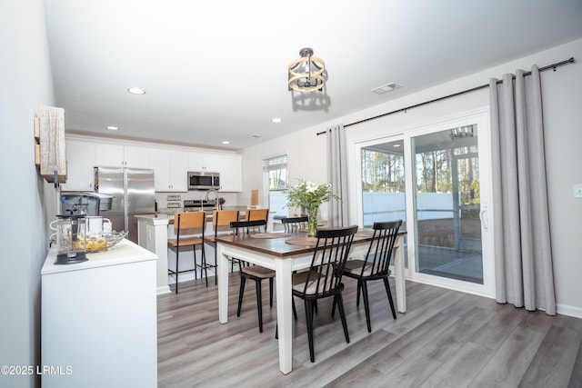 dining room featuring light hardwood / wood-style flooring