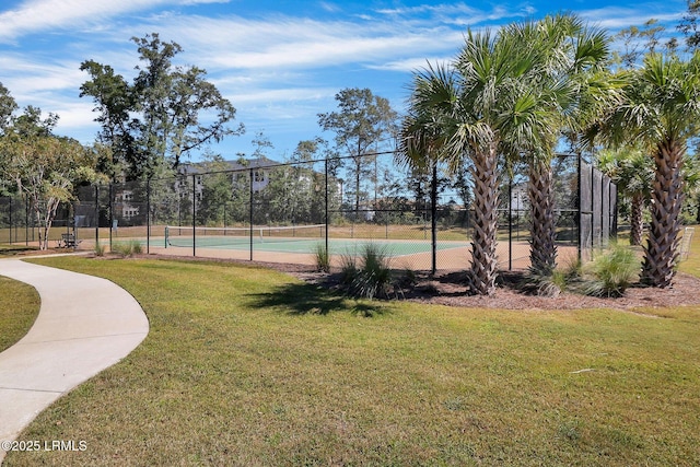 view of sport court featuring a yard