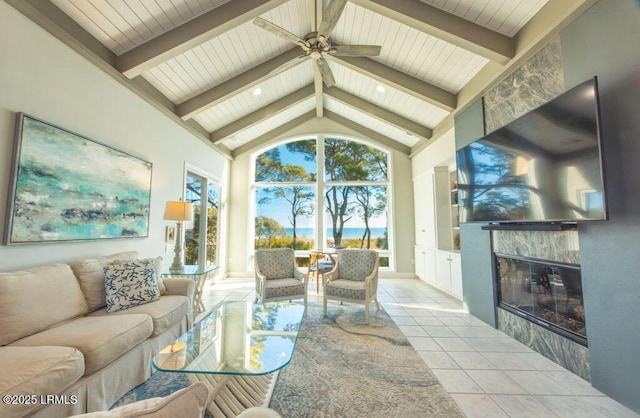 living room featuring high vaulted ceiling, wooden ceiling, light tile patterned floors, beamed ceiling, and a fireplace