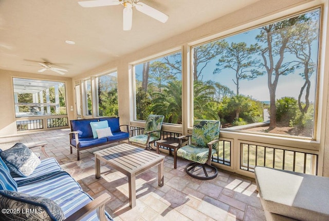 sunroom / solarium with ceiling fan