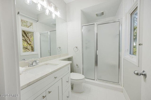 bathroom with vanity, toilet, an enclosed shower, and a wealth of natural light