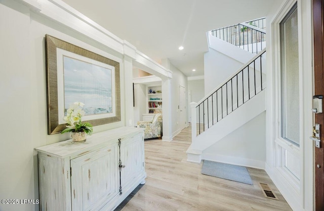 foyer with light hardwood / wood-style floors