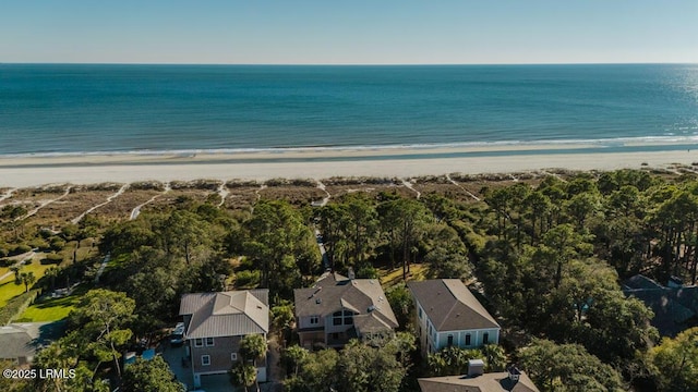 bird's eye view with a water view and a beach view