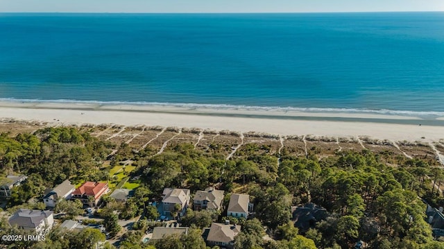 drone / aerial view with a water view and a beach view