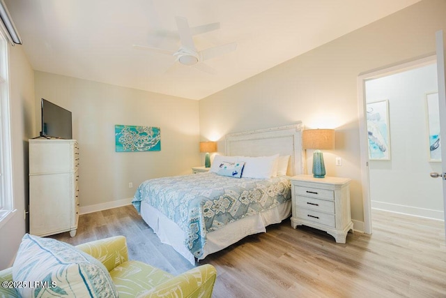 bedroom featuring ceiling fan and light hardwood / wood-style flooring