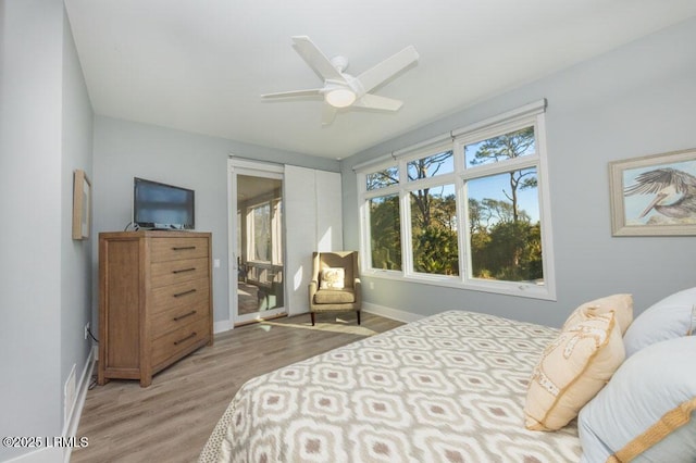 bedroom featuring light hardwood / wood-style flooring and ceiling fan