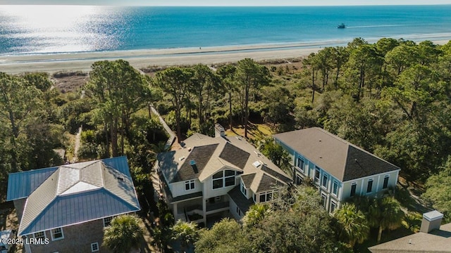 bird's eye view with a water view and a view of the beach