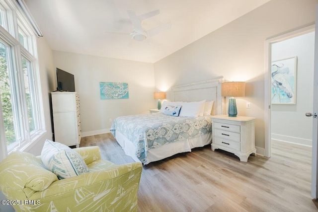 bedroom with light hardwood / wood-style floors and ceiling fan