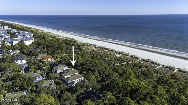 drone / aerial view with a beach view and a water view