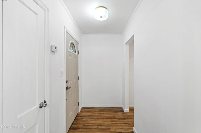 hall featuring dark hardwood / wood-style flooring and crown molding