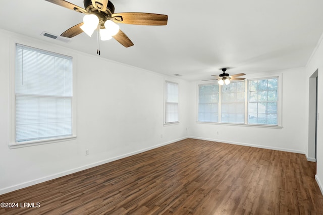 unfurnished room with crown molding and dark hardwood / wood-style floors