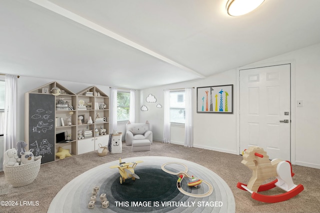 sitting room with vaulted ceiling and carpet