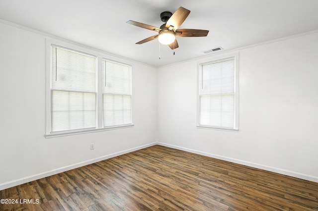 unfurnished room featuring ceiling fan, ornamental molding, and dark hardwood / wood-style floors