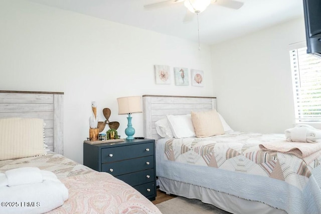 bedroom with ceiling fan and wood finished floors