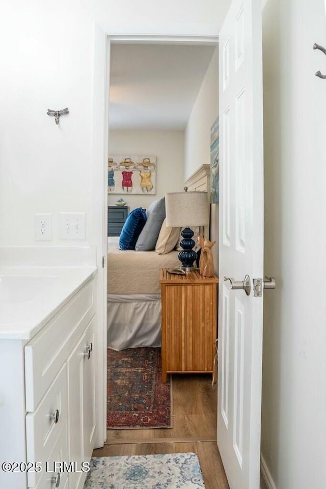 bedroom with light wood finished floors