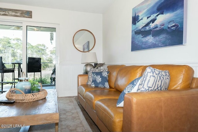 living area featuring a wainscoted wall