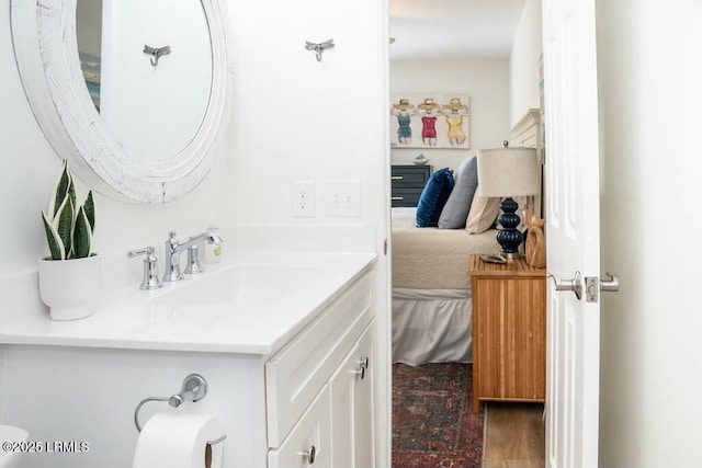 bathroom with vanity and ensuite bathroom