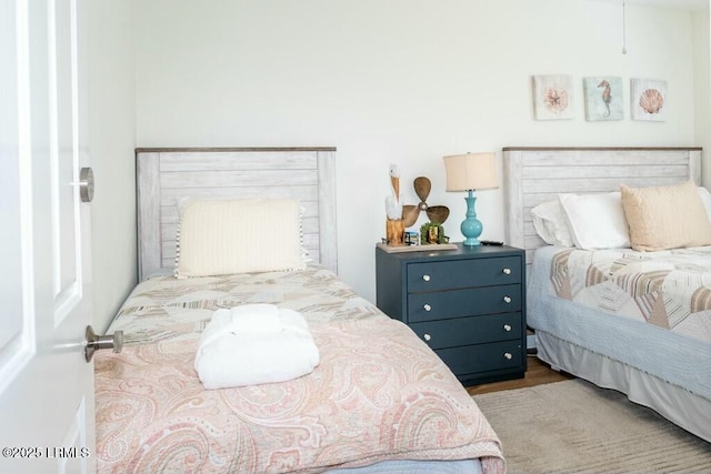 bedroom featuring wood finished floors