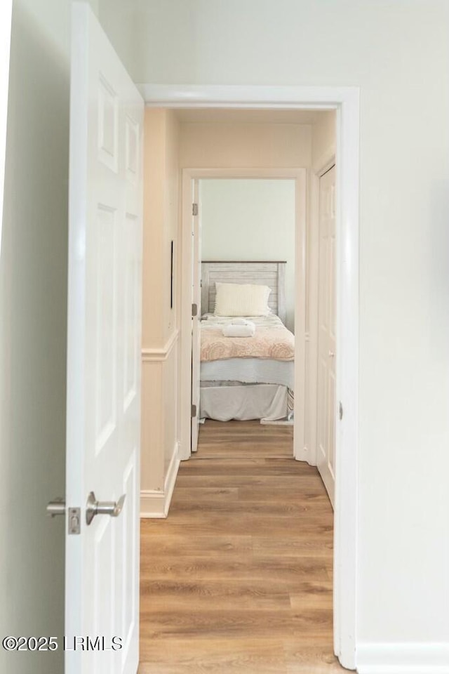 corridor with light wood-style floors