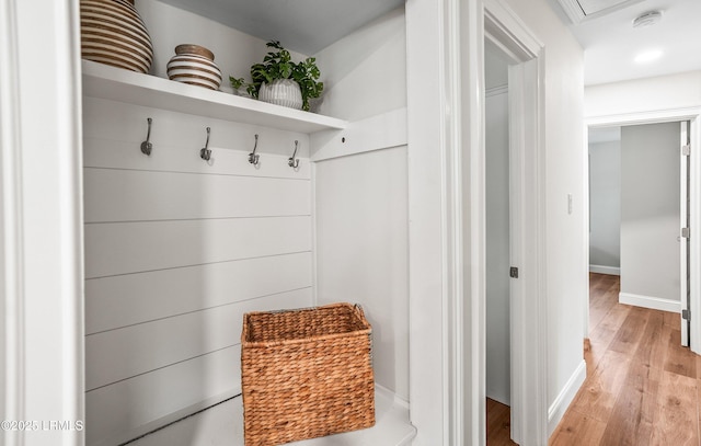 mudroom with light wood-type flooring and baseboards